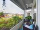 Screened porch with wicker chairs and neighborhood view at 2610 San Marco Way, Winter Haven, FL 33884