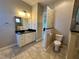 Bathroom with vanity, toilet, and granite countertop at 265 Laynewade Rd, Polk City, FL 33868