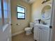 Clean bathroom with white vanity and flooring at 265 Laynewade Rd, Polk City, FL 33868