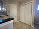 Bathroom with granite countertop and double doors to closet at 265 Laynewade Rd, Polk City, FL 33868