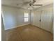 Bright bonus room with double doors and ceiling fan at 265 Laynewade Rd, Polk City, FL 33868