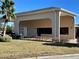 Tan house with covered carport and landscaping at 265 Laynewade Rd, Polk City, FL 33868