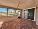 Covered patio with sliding glass doors and ceiling fan at 265 Laynewade Rd, Polk City, FL 33868