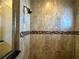 Shower with tile surround and glass enclosure at 265 Laynewade Rd, Polk City, FL 33868