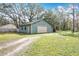 Detached garage with single car door and large yard at 2720 Ewell Rd, Lakeland, FL 33811