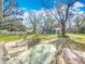 Relaxing patio with table and chairs, overlooking the yard at 2720 Ewell Rd, Lakeland, FL 33811