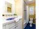 Charming bathroom with blue sink and white vanity at 2729 Woodland Hills Ave, Lakeland, FL 33803