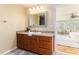 Bathroom with vanity, mirror and view to bedroom at 2729 Woodland Hills Ave, Lakeland, FL 33803