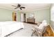 Serene bedroom with king bed and two armchairs at 2729 Woodland Hills Ave, Lakeland, FL 33803