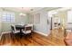 Well-lit dining room with hardwood floors and stylish decor at 2729 Woodland Hills Ave, Lakeland, FL 33803