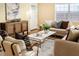 Living room with hardwood floors, neutral furniture, and a large window at 2729 Woodland Hills Ave, Lakeland, FL 33803