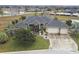 Aerial view of a single-Gathering home with a large backyard and three-car garage at 2774 Verandah Vue Way, Lakeland, FL 33812