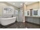 Spa-like bathroom with soaking tub, walk-in shower, and double vanity at 2774 Verandah Vue Way, Lakeland, FL 33812