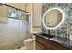 Modern bathroom with a frameless glass shower and blue mosaic tile at 2774 Verandah Vue Way, Lakeland, FL 33812