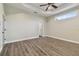 Simple bedroom with wood-look floors and neutral walls at 2774 Verandah Vue Way, Lakeland, FL 33812