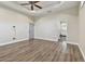 Bright bedroom with wood-look floors and access to bathroom at 2774 Verandah Vue Way, Lakeland, FL 33812