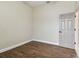 Empty bedroom with dark brown floors and neutral walls at 2774 Verandah Vue Way, Lakeland, FL 33812