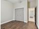 Spacious bedroom with wood-look floors and access to hallway at 2774 Verandah Vue Way, Lakeland, FL 33812