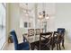 Elegant dining room with dark wood table and blue chairs at 2774 Verandah Vue Way, Lakeland, FL 33812