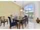 Formal dining room featuring a large window and fireplace at 2774 Verandah Vue Way, Lakeland, FL 33812