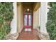 Front entry with red double doors and a tile floor at 2774 Verandah Vue Way, Lakeland, FL 33812