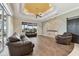 Bright living room features hardwood floors and sliding glass doors at 2774 Verandah Vue Way, Lakeland, FL 33812