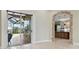 Open living room with view of pool and kitchen at 2774 Verandah Vue Way, Lakeland, FL 33812