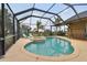 Enjoy this lovely kidney-shaped pool and spa with screened enclosure at 2774 Verandah Vue Way, Lakeland, FL 33812