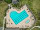 Heart-shaped pool with lounge chairs and umbrellas at 2961 Sanctuary Cir, Lakeland, FL 33803