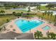 Community pool and spa with golf course view at 2961 Sanctuary Cir, Lakeland, FL 33803