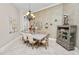 Formal dining area featuring a modern table and neutral decor at 2961 Sanctuary Cir, Lakeland, FL 33803