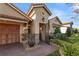 Welcoming entryway with decorative iron gate and brick walkway at 2961 Sanctuary Cir, Lakeland, FL 33803