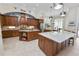 Large kitchen with granite countertops, island and breakfast bar at 2961 Sanctuary Cir, Lakeland, FL 33803