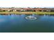 Lake view with fountain and homes at 2961 Sanctuary Cir, Lakeland, FL 33803