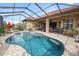 Inviting pool and spa with screened enclosure at 2961 Sanctuary Cir, Lakeland, FL 33803