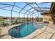 Enjoy this pool and spa with lake view at 2961 Sanctuary Cir, Lakeland, FL 33803