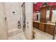 Large walk-in shower with built-in seat and multiple shower heads at 2961 Sanctuary Cir, Lakeland, FL 33803