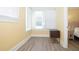 Bedroom with bamboo flooring and window with blinds at 306 Avenue C Ne, Winter Haven, FL 33881