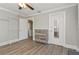 Bright bedroom with hardwood floors and closet at 306 Avenue C Ne, Winter Haven, FL 33881