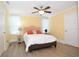 Bedroom with a bed, nightstand, and ceiling fan at 306 Avenue C Ne, Winter Haven, FL 33881