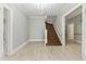 Bright entryway with hardwood floors and a grand staircase at 306 Avenue C Ne, Winter Haven, FL 33881