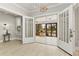 Entryway with hardwood floors, chandelier, and access to sunroom at 306 Avenue C Ne, Winter Haven, FL 33881