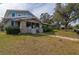 Charming two-story home with stone accents and a spacious lawn at 306 Avenue C Ne, Winter Haven, FL 33881