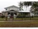 Two-story house with stone accents and a metal roof at 306 Avenue C Ne, Winter Haven, FL 33881