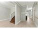 Hallway with hardwood floors, fireplace, and staircase at 306 Avenue C Ne, Winter Haven, FL 33881