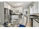 Modern kitchen with stainless steel appliances and breakfast area at 306 Avenue C Ne, Winter Haven, FL 33881