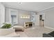 Living room features hardwood floors and access to kitchen at 306 Avenue C Ne, Winter Haven, FL 33881