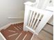 Wooden staircase with white railings and brown steps at 306 Avenue C Ne, Winter Haven, FL 33881