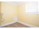 Small storage room with wood flooring and white door at 306 Avenue C Ne, Winter Haven, FL 33881