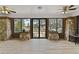 Bright sunroom with stone walls and light flooring at 306 Avenue C Ne, Winter Haven, FL 33881